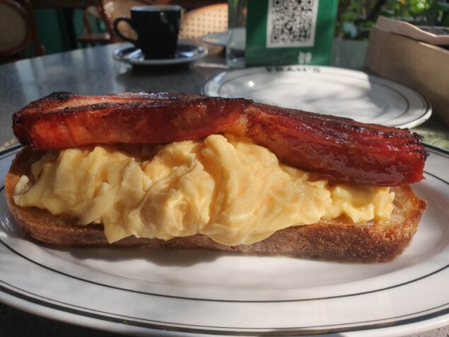 Fran's Brunch and Greens velvet eggs and thick cut bacon on maple glazed sourdough