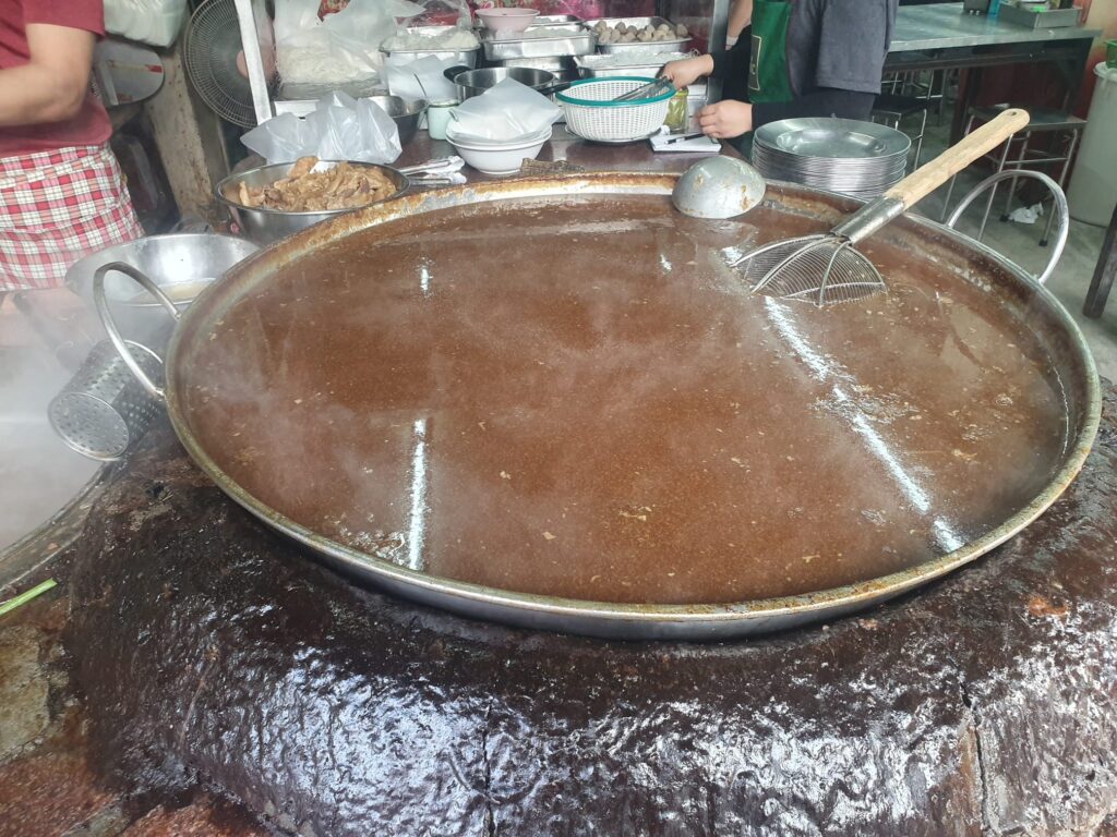 Legendary Wattana Panich beef broth simmering