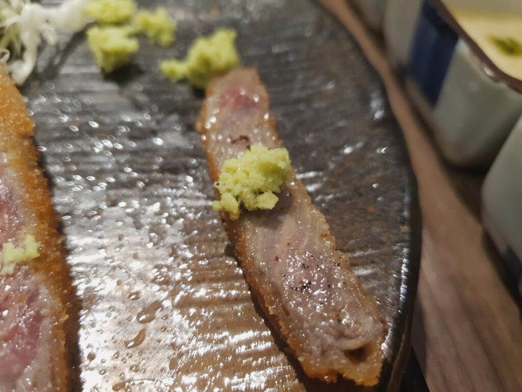 cooked gyukatsu with wasabi on top