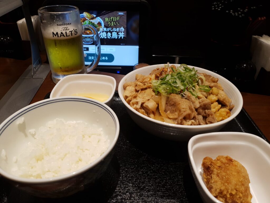 Yoshinoya stamina bowl, karaage, draft beer, and extra bowl of rice