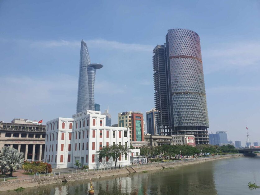 view of Bitexco Financial Tower and District 1 from footbridge in District 4 Saigon