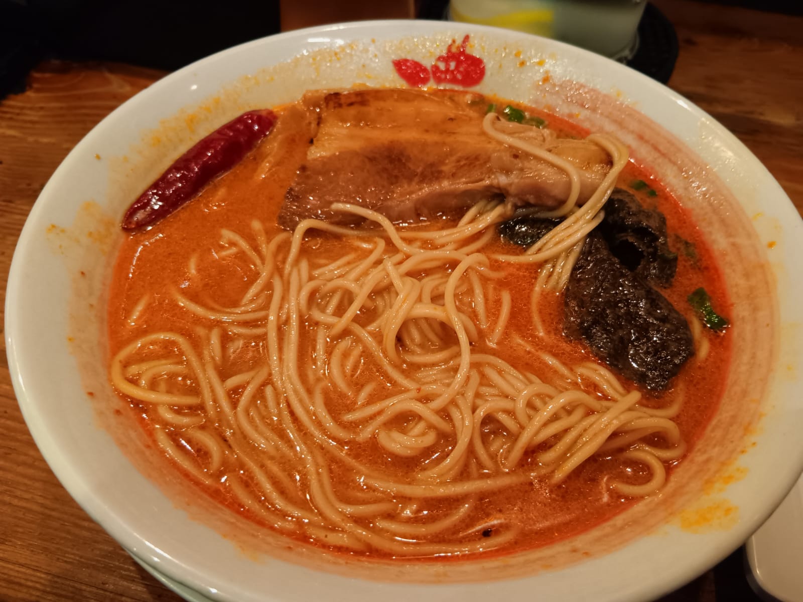 close-up of spicy tonkotsu ramen with chili at Ramen Bari-Uma