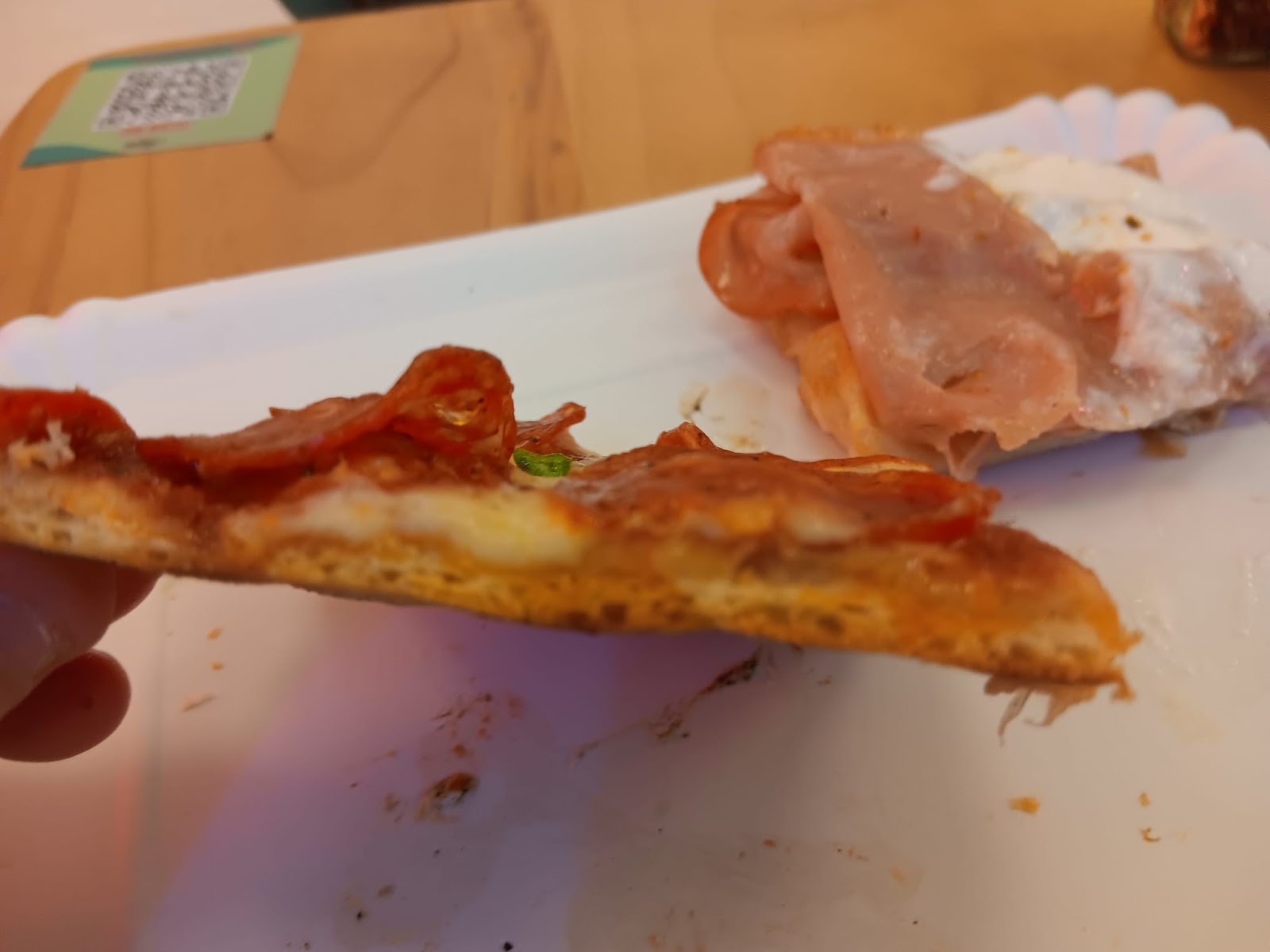 profile of pepperoni thin-crust slice at Alice Pizza