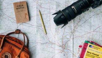 map camera pencil and other travel tools