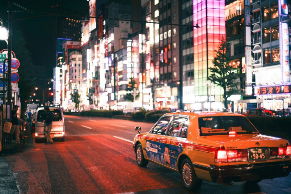 yellow Japanese taxi at night