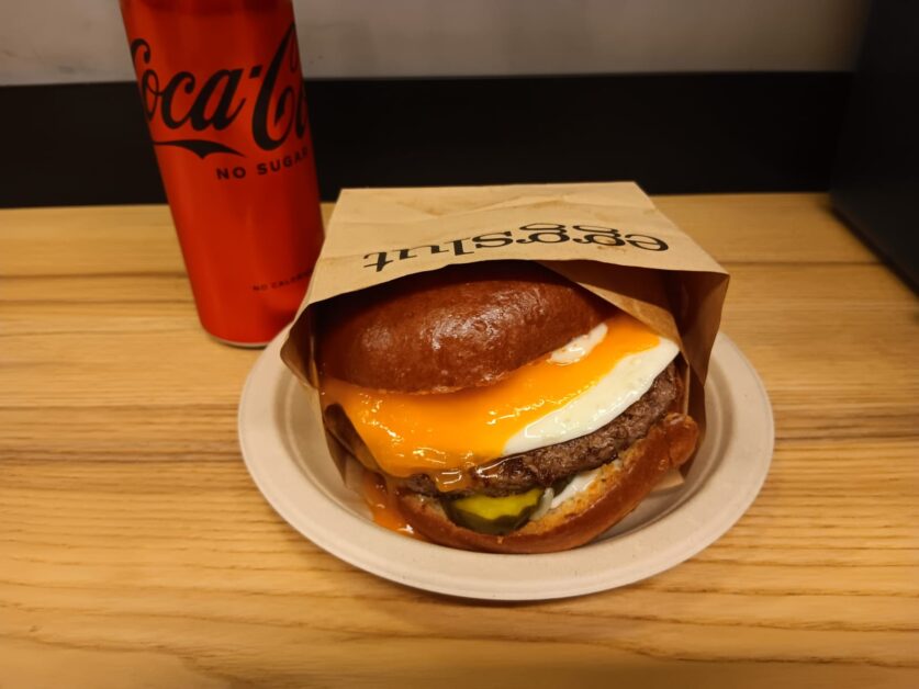 Eggslut cheeseburger and Coke Zero