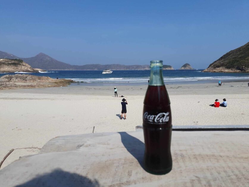 glass Coke bottle at Ham Tin beach in Sai Kung