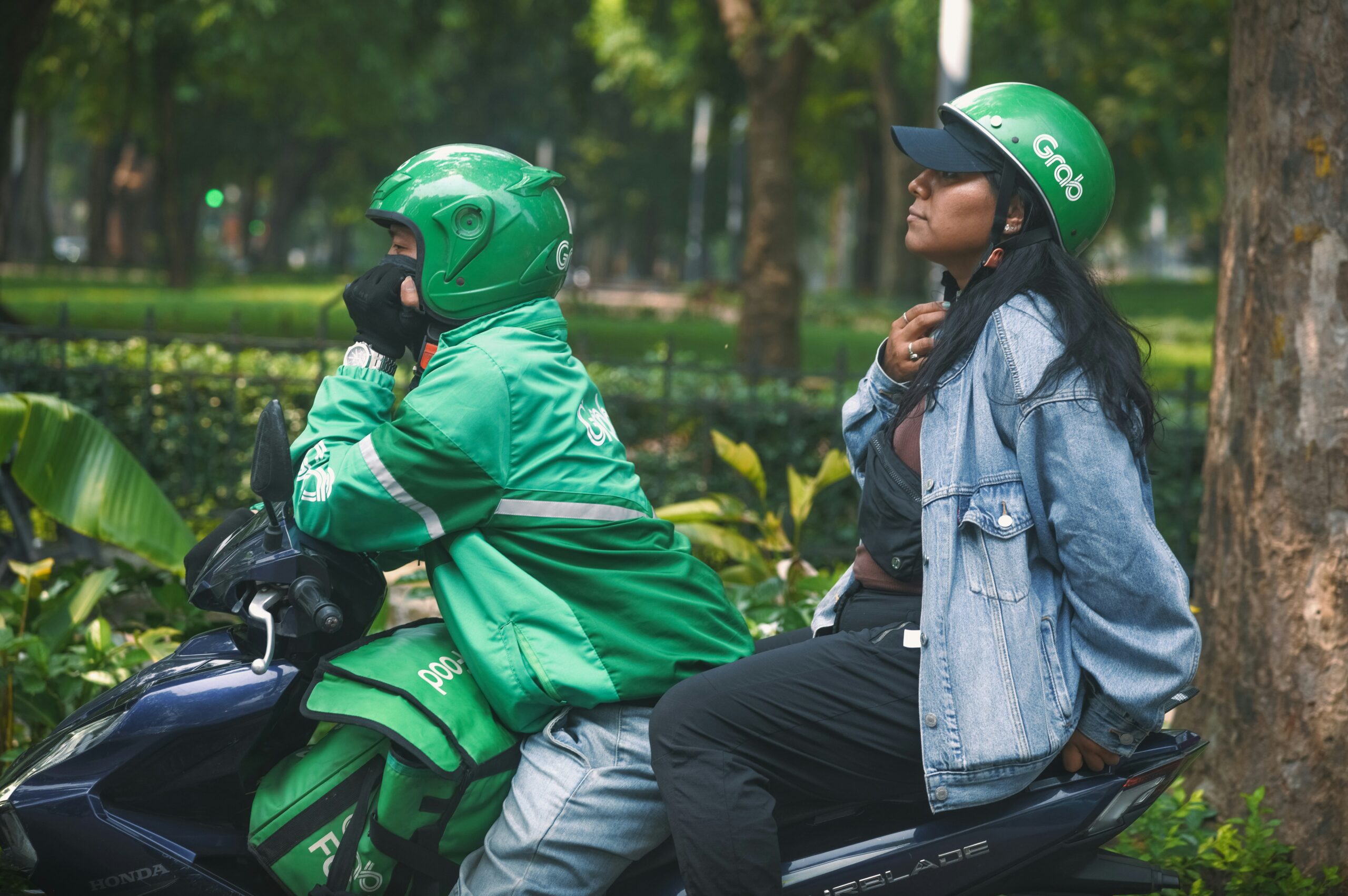 Grab driver with woman on bike